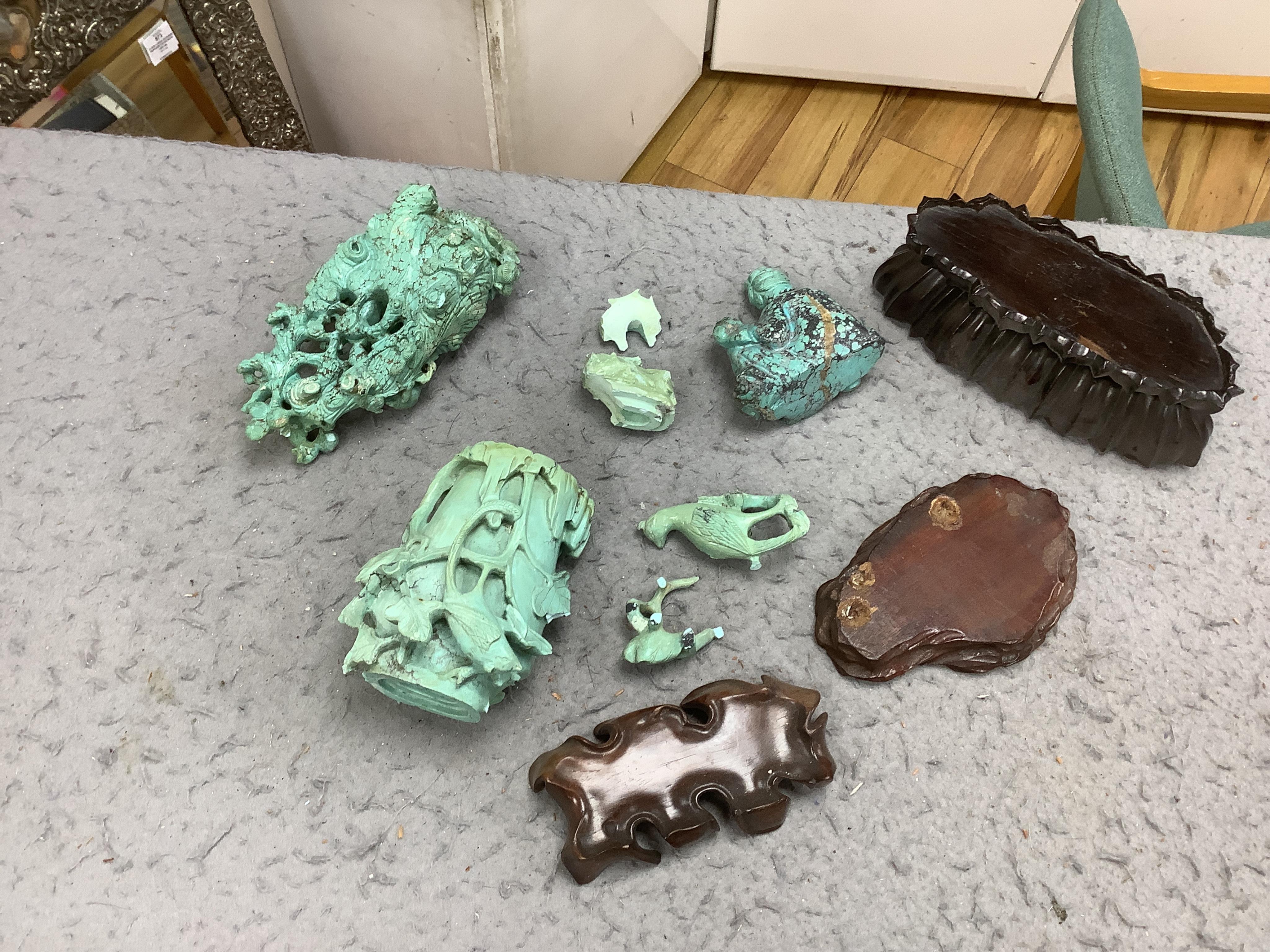 A group of Chinese turquoise matrix carvings, comprising a boy on a buffalo, 5.5in. a brushwasher, 7in. a vase and cover, 6.5in. a snuff bottle and a figure of a woman, 4.5in. (all a.f.)